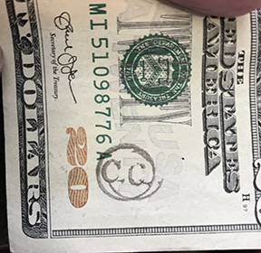 C.C. stamp on money